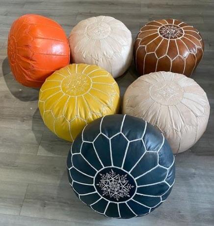 5-Leather-Poufs-on-Wooden-Floor